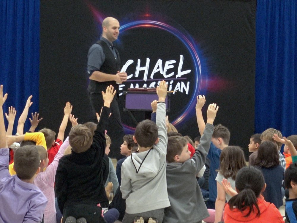 Professional magician performing at a schools